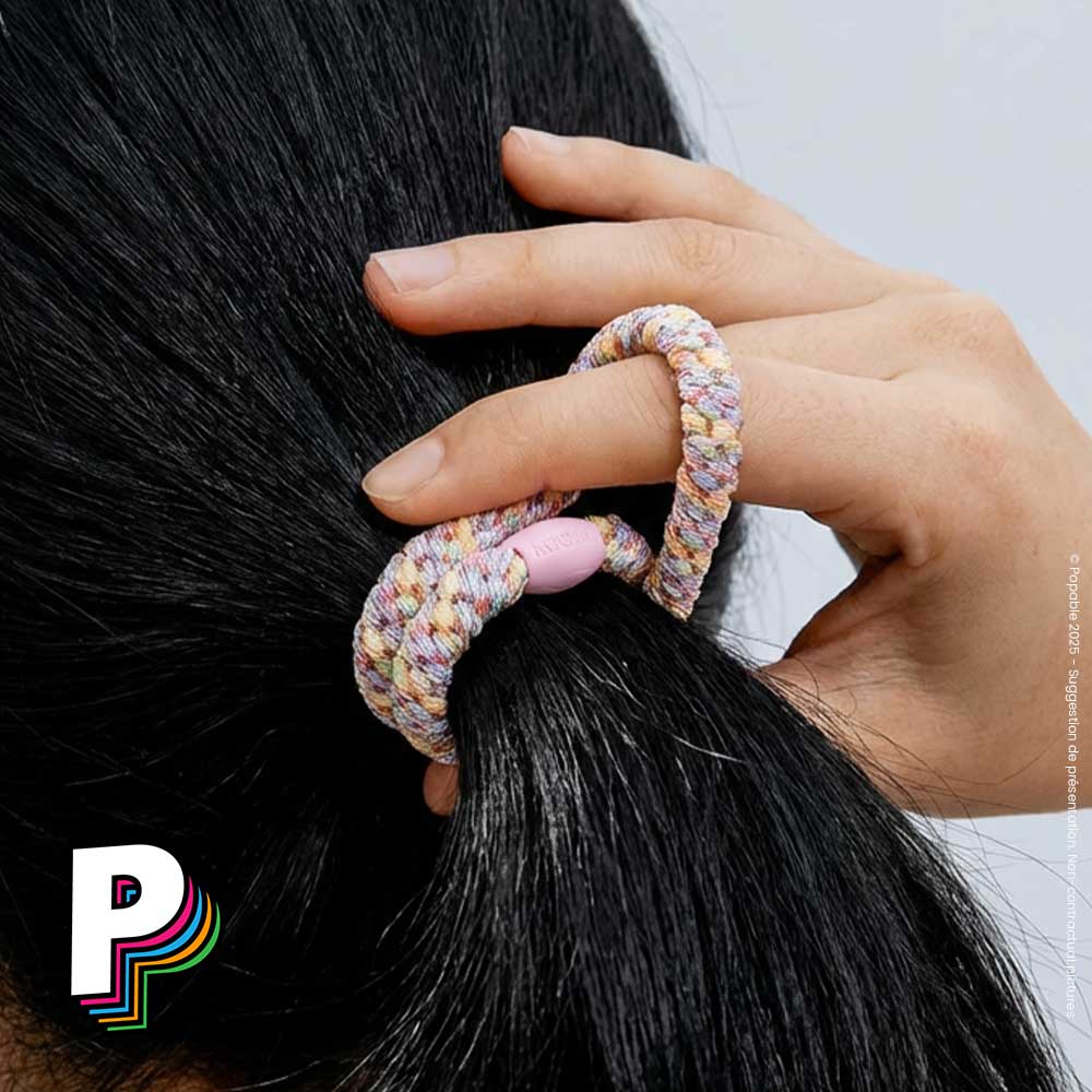 Elastique pailleté cirque pastel dans les cheveux 