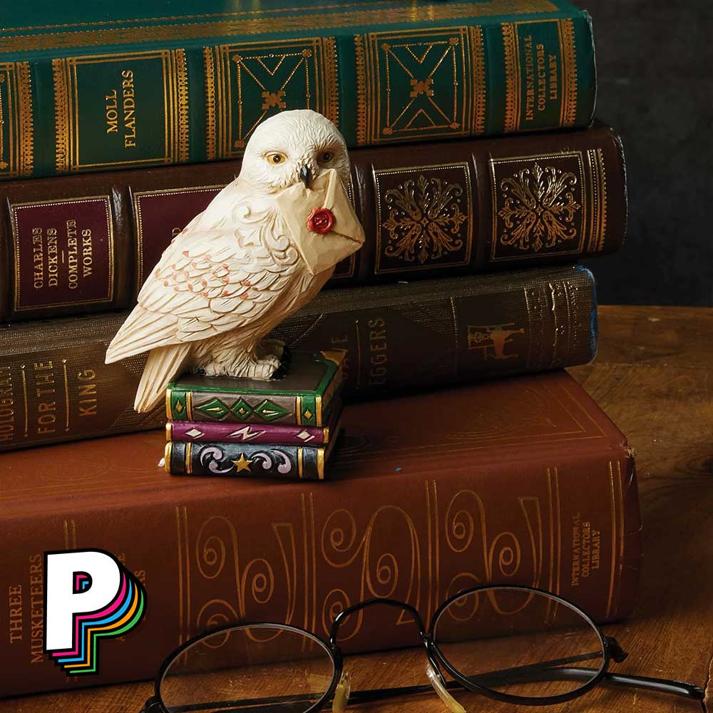 Figurine Hedwige sur livres chouette de Harry Potter by Jim Shore avec livre