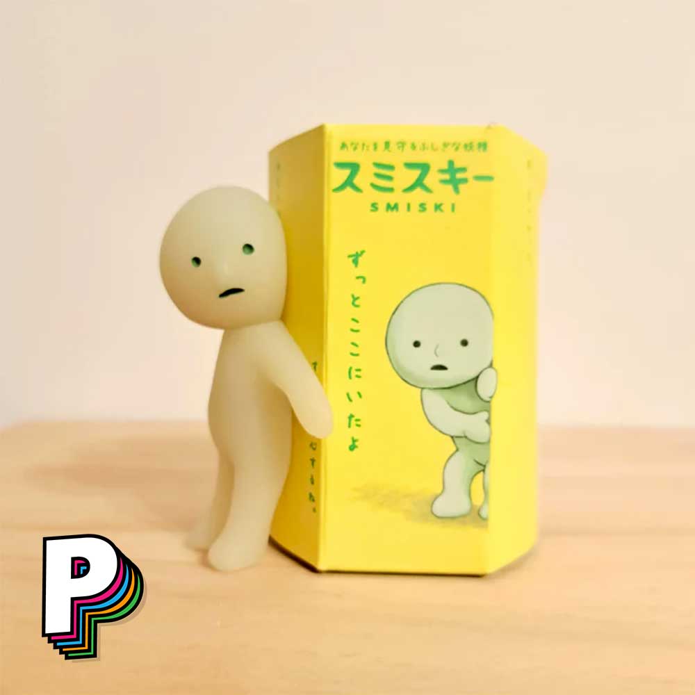 Figurine Smiski colé à sa boite