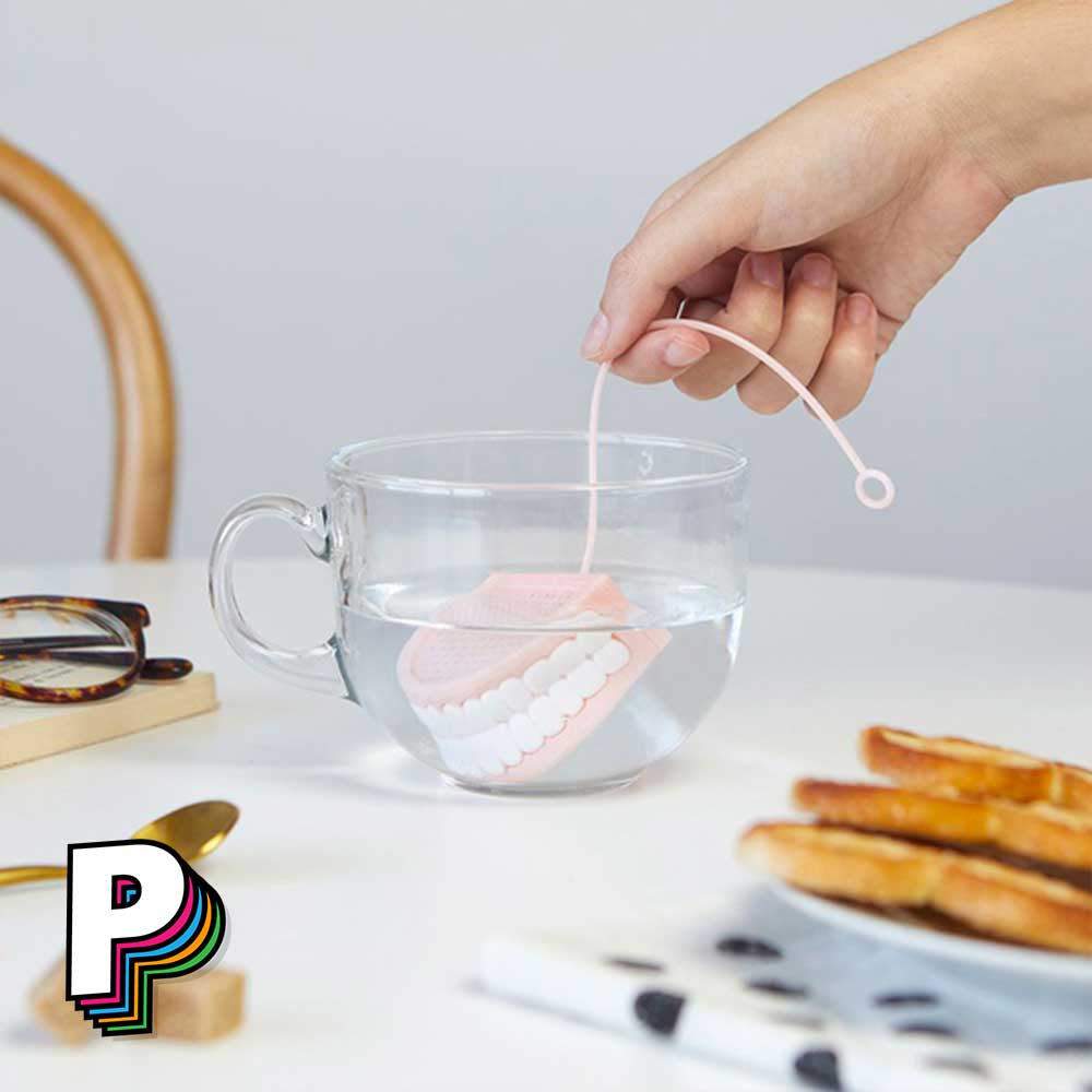 Infuseur thé dentier rose et blanc en silicone au petit-dejeuner
