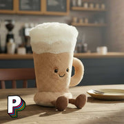 Peluche Café Latte Amuseables de Jellycat dans un café
