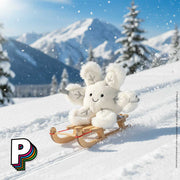 Peluche Flocon de Neige Amuseables de Jellycat sur une luge