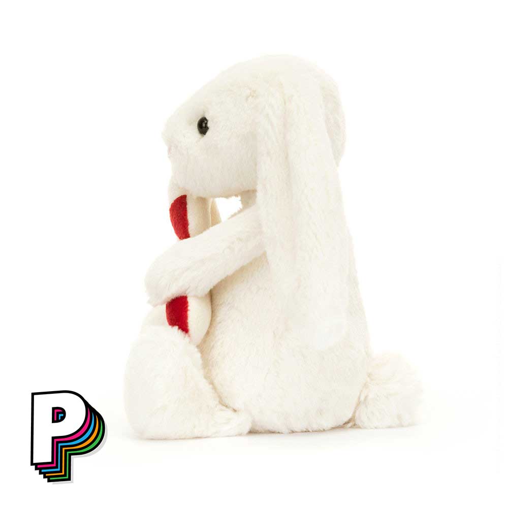 Peluche Lapin Bashful avec sucre d'orge de Jellycat de côté