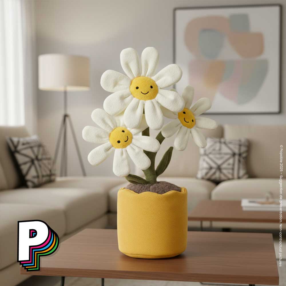 Peluche pot de Marguerites en fleurs Amuseables de Jellycat sur une table basse dans un salon