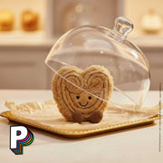 Amuseables Philippe Palmier Jellycat dans une boulangerie avec une cloche à gateau 