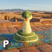 Peluche serpent Cizi de Jellycat sur toit terrasse maison désert