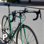 Sonnette vélo Brooklyn Bike de LIIX sur un vélo vert